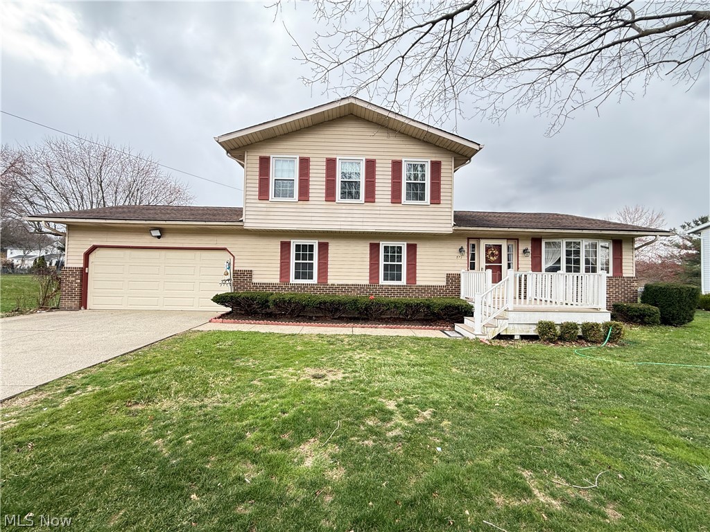 Welcome to this inviting split-level home that blends comfort, functionality, and modern updates—perfect for families, entertaining, or anyone looking for flexible living space.

Step onto the newer vinyl  front porch, offering both durability and curb appeal. Inside, you’ll find a thoughtfully designed layout with 4 spacious bedrooms and 2 bathrooms. The first floor features a convenient bedroom and bathroom, ideal for guests, multi-generational living, or a home office. Upstairs, three additional bedrooms with closets provide comfortable private spaces, along with a full bathroom for added convenience.

The main level is warm and welcoming, highlighted by a cozy fireplace in the family room, creating the perfect spot for relaxing evenings or gathering with friends and family. A sliding glass door leads out to a peaceful, shaded deck, offering a great setting for outdoor dining, morning coffee.

Recent updates include new flooring installed in 2025 throughout the living room, dining room, and family room, bringing a fresh, modern feel to the home. The basement offers laundry hookups and additional space that can be used for recreation, hobbies, or extra storage.

Conveniently located near shopping centers, restaurants, parks, and sports fields, this home makes it easy to enjoy both everyday conveniences and outdoor activities like walking, hiking, and family games.

Don’t miss the opportunity to make this charming home your own—schedule a private showing with your favorite realtor today!