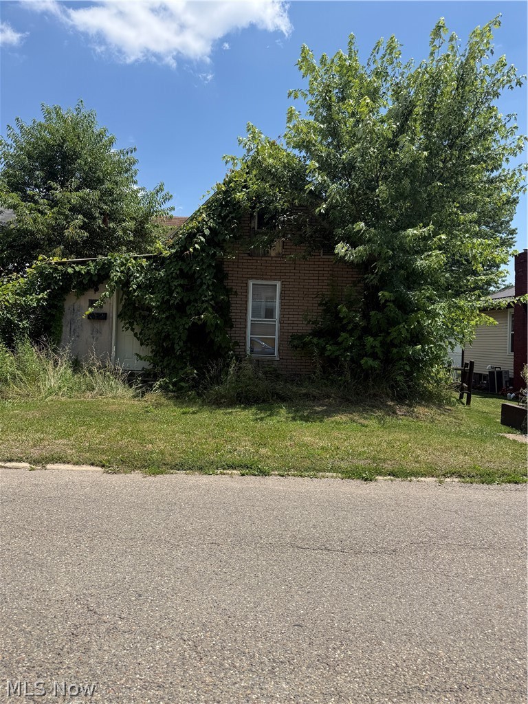 ATTENTION INVESTORS & DIY BUYERS! Incredible opportunity in Uhrichsville. The current owner started extensive renovations but left them unfinished, providing a blank canvas for you to step in and finalize your vision. Spanning 1,528 square feet, this classic 4-bedroom, 1-bathroom home features a functional layout with two first-floor bedrooms, a main-level bathroom, and a detached garage with off-street parking. Being sold strictly AS-IS!