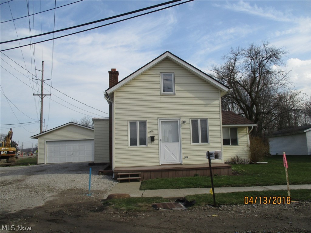 This home has a nice size yard, 2 car detached garage, and deck.  Interior has 1 bedroom down with a media room and bedroom on 2nd floor.