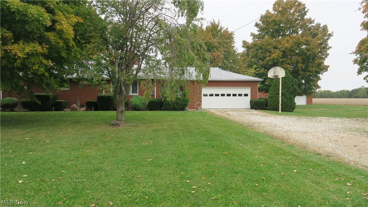 A lovely well-built country ranch brick home located on almost 1.5 acres just outside of town!  This 3-bedroom cozy charmer has a fireplace on the main level and the basement. All the bedrooms have wood floors and cedar lined closets. There is 1.5 bathrooms with the full bathroom having large built in cabinets.  Attached is a two-car garage and a 4 seasons room to enjoy your morning coffee! There is also a detached brick garage (24ft x 32ft) and a full basement to potentially finish. New roof 2020.

Third party septic inspection and repairs have been completed 2020.