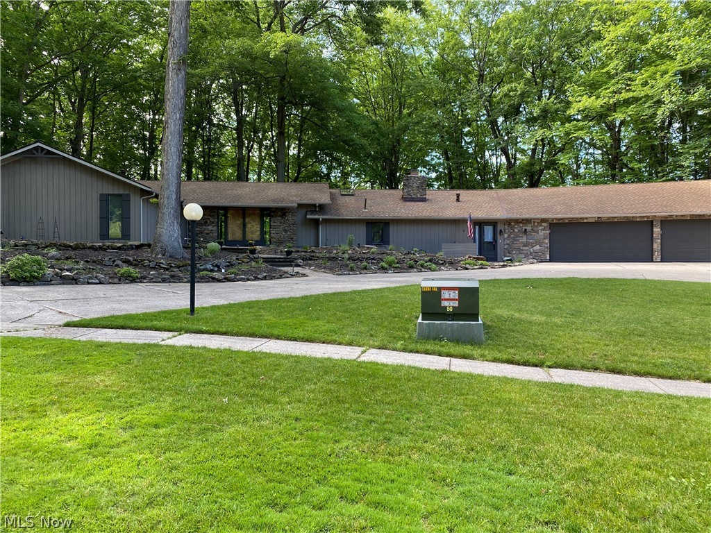 Stunning Luxurious Sprawling Bob Schmidt Ranch in Ledgewood, Strongsville. 4 bedrooms. 2.5 bathrooms. Over 3800 square feet. Home has been remodeled. Stone and wood on exterior - turn around driveway. 3 car Heated attached garage. Open floor plan. Huge family room connected to a wide open gorgeous updated kitchen that has granite countertops and built in appliances. Large living room off the Double Solid Wood doors that have a intricate design. Enormous Master Bedroom is something to be seen - open closet design, Master bath with soaking tub and gorgeous shower. The Master bedroom has its own fireplace and beamed ceilings. Multiple newer patio doors that lead to a deck that covers the back of the house (approx 3,000 sqft deck). Multi level Deck has 2 gazebos and a pergola. Deck overlooks scenic parklike wooded land that is a nature lovers dream- it truly is a breath taking view.