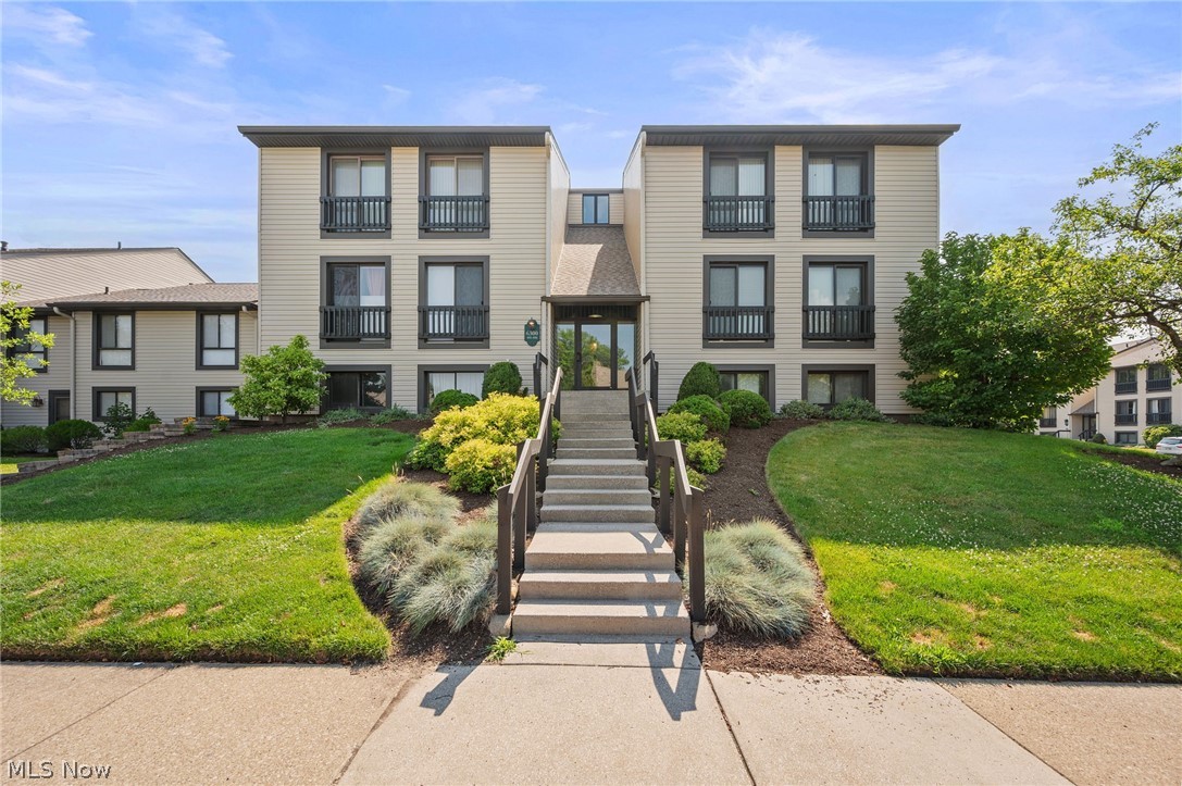 Completely updated Ranch-style condo in the Oak Knolls community, part of the sought-after Greenwood Village community in Sagamore Hills, offering low-maintenance one-floor living and exceptional resort-style amenities. Enjoy access to 2 outdoor pools (one exclusively for Oak Knolls residents), an indoor pool, clubhouse with fitness center and saunas, tennis courts, playground, stocked pond, beautifully maintained grounds, and walking trails connecting directly to Cuyahoga Valley National Park and the Akron Bike & Hike Trail. This move-in ready home features 2 bedrooms, 2 updated full baths, abundant natural light, a private covered balcony, and a dedicated garage space adjacent to the building. An updated kitchen offers stainless steel appliances, granite countertops, a tile backsplash, and ample cabinetry, opening to a spacious dining area. A bright living room provides plenty of space to relax and entertain with direct access to the covered balcony. The primary suite features a walk-in closet and an updated en-suite bath with a tiled walk-in shower. INCLUDED are ALL kitchen appliances, TV mounts, and window treatments. Conveniently located near I-271, OH-8, OH-82, shopping, restaurants, schools, parks, and other local attractions.