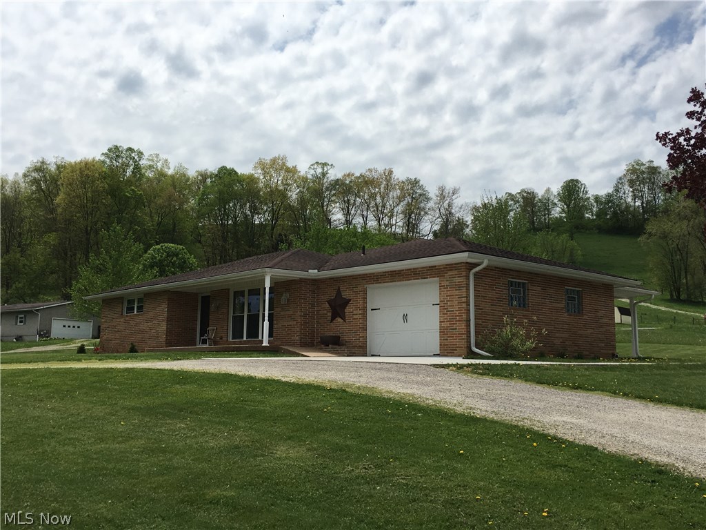 Clean & neat 3 bedroom ranch outside of town on .75 acre lot.  2 bedroom and a full bath on the main level. Large kitchen with stainless appliances, breakfast  bar and separate dining area. Nicely updated throughout. Fireplace in lower level w/ a large bedroom and remodeled full bath.  20' x 12' covered patio, new concrete 2017'. Attached 1 car garage and a 24'x20' detached garage. Beautiful. A must see!