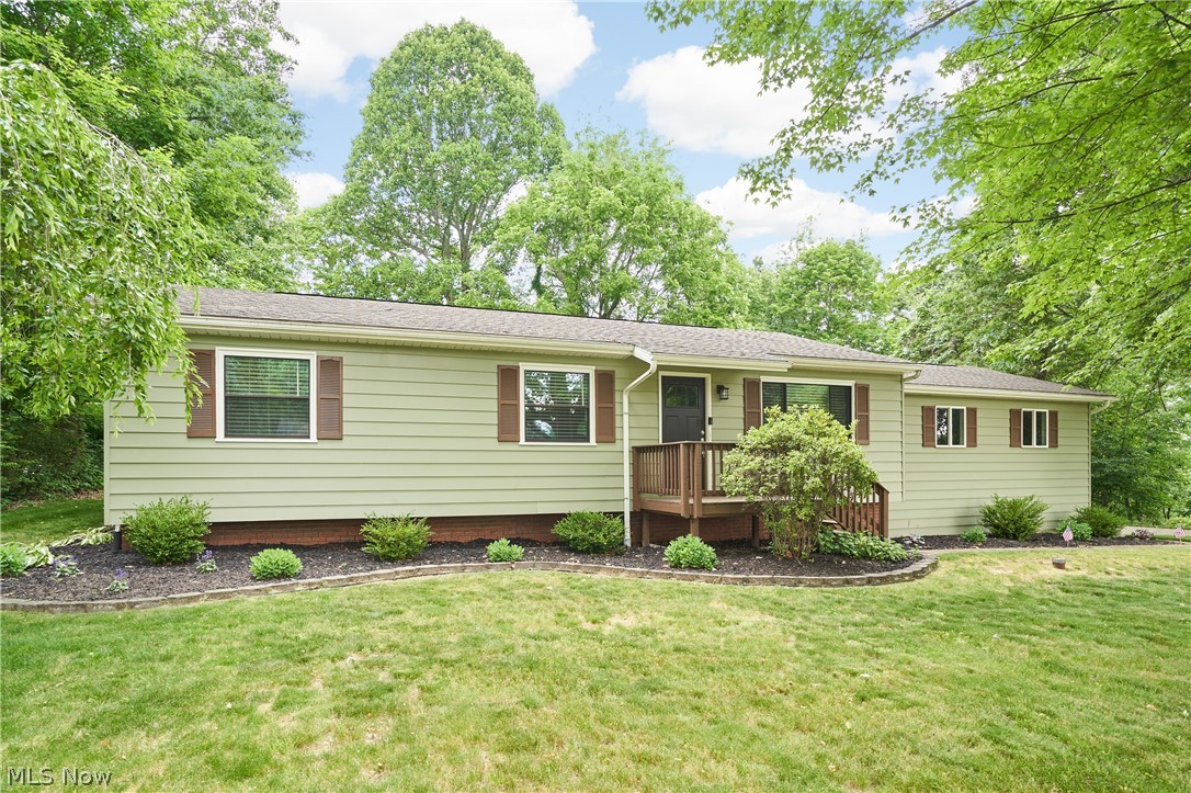 Welcome to this beautifully maintained ranch nestled at the end of a quiet cul-de-sac in the highly sought-after
Green Local School District. Offering the perfect blend of comfort, style, and functionality, this move-in-ready home is sure
to impress from the moment you arrive. Step inside to an inviting family room highlighted by a stunning custom stone
fireplace accented with recessed lighting, creating a warm and elegant focal point for everyday living and entertaining
alike. The thoughtfully designed galley-style kitchen features stainless steel appliances, richly stained cabinetry, and an
efficient layout that maximizes both workspace and storage. The main level offers two generously sized secondary
bedrooms and a well-appointed hall bathroom featuring an oversized tub and shower surround. Retreat to the spacious
owner's suite, complete with abundant closet space and a private en-suite bath, providing the perfect sanctuary at the
end of the day. Downstairs, the finished lower level expands your living space with newly installed recessed lighting that
brightens the entire area, making it ideal for a recreation room, home office, fitness space, or additional entertaining area.
As the warmer months approach, you'll love relaxing on the rear deck overlooking the private backyard—an ideal setting
for morning coffee, summer barbecues, or quiet evenings outdoors. Located on a peaceful dead-end street while
remaining convenient to shopping, dining, parks, and major highways, this exceptional home offers the lifestyle you've
been searching for. Schedule your private showing today—opportunities like this don't last long.