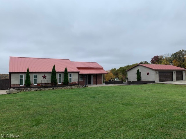Incredible setting with beautiful views of the countryside. This two bedroom, 2.5 bath, very unique, Saltbox-style home sits on 2.5 acres. The sunken living room and "chef" like kitchen has 13-foot ceilings with combination of materials from stainless steel to shaker. Gorgeous stone gas fireplace with built-in bookcases and access shelving in the living room. Everywhere you turn are quaint architectural features. The master bedroom offers a private bath and walk-in closet. The upper bonus room is perfect for an office or could be a a 3rd bedroom. Large deck with patios and firepit to enjoy the views. A new 3-car detached garage with paved driveway. An outbuilding for your little animals or storage. New roof 2018. Call today for a private tour!