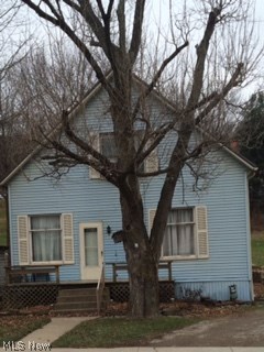 Great starter home or investment property. Master bedroom with half bath on the 1st floor with remaining bedrooms and full bath on the 2nd floor. High ceilings, old charm woodwork, home needs some TLC but can be lived in immediately, no garage but LARGE lot next to creek. Come see this today! Motivated Seller,  $6 ANNUAL MWCD assessment