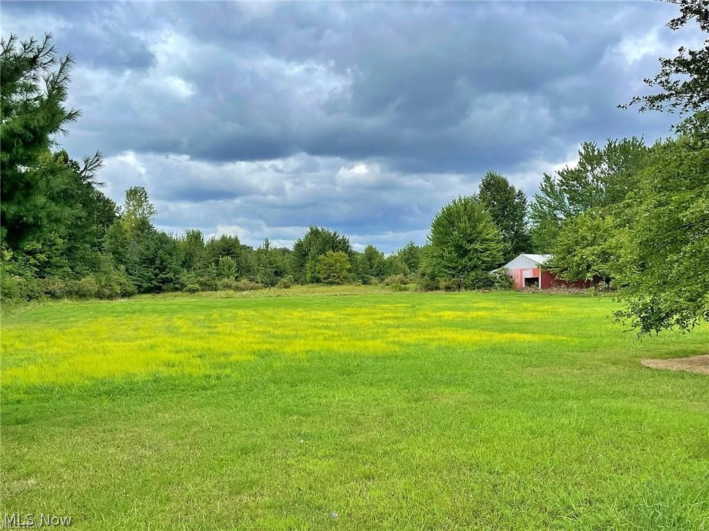 Nestled within the desirable Firelands School District, this exceptional 16.75-acre parcel offers the perfect blend of open space and natural beauty. With this property being zoned Commercial/Industrial/Residential, you can do almost anything! The front two acres are clear and flat, providing an ideal canvas for your dream home, with ample room for a spacious yard or additional outbuildings. Behind this, the property transitions into a picturesque wooded area, offering privacy and a serene backdrop. This wooded section is perfect for outdoor enthusiasts, whether you enjoy hunting, exploring trails, or riding ATVs throughout the seasons. Set in a peaceful country setting, this land offers a unique opportunity to create a private retreat while remaining conveniently located close to Route 2 and within the community.
