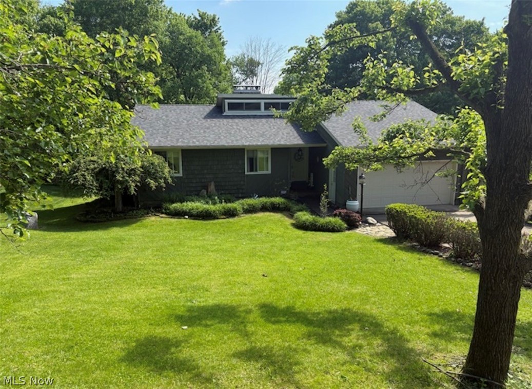 Welcome to this beautiful 4-bedroom, 3 full bath home located at the end of a quiet dead-end street in East Liverpool. Situated on 1.1 acres across two parcels and surrounded by mature trees and landscaping, this property offers privacy and a peaceful setting.
Inside you’ll find an open and inviting layout highlighted by vaulted ceilings and a loft area. The home features a newer roof(2026), updated kitchen, recently painted interior, and multiple heating options including two LP gas fireplaces and a hardwood pellet stove for added warmth and comfort.
Step outside and enjoy the outdoor living spaces including an upper-level deck, lower-level patio, hot tub, and a beautiful goldfish pond with waterfall and filtration system, creating the perfect environment for relaxing or entertaining.
Car enthusiasts or hobbyists will appreciate the four-car garage setup, spacious one car garage and detached two car garage with Work area.
Additional highlights include a Generac whole-house generator, underground pet fence surrounding the property, Guardian security system, and a large storage shed.
This property offers space, privacy, and versatility in a quiet setting.