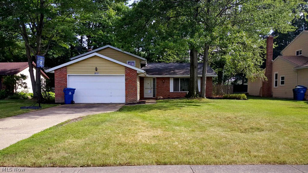 Nicely updated 3 bedroom 1.5 bath split on wooded lot. Vaulted living room open to the dining room. Neutral throughout. Ceramic tile floors throughout main living level. Eat-in kitchen with loads of storage and updated appliances. Dinette opens to patio and large back yard through sliders. 3 bedrooms and updated bath on 2nd. 1st floor family room with wood burning fireplace and half bath. Attached 2 car garage off laundry room. Nice yard. Quiet street. Close to amenities and freeways.