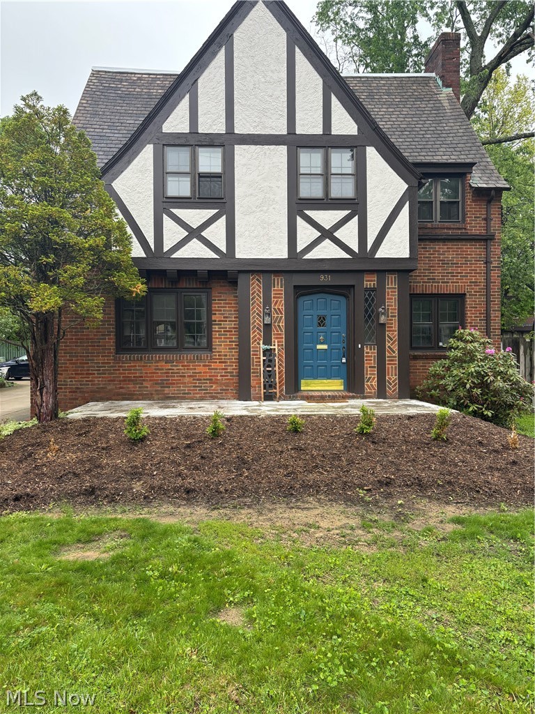 Welcome Home to 931 Amelia! This classic and timeless 4 bedroom 3 bathroom ALL Brick Colonial in one of West Akron's historic neighborhoods. A perfect blend of convenient and modern updates and original details will make this house one you will proud to call HOME. Welcome your guests in through the front door and immediately the history and charm begins. Original custom woodwork, glass door knobs and leaded glass are just a few of the details. Incredibly crafted crown molding and a gorgeous fireplace anchor this light filled and spacious living room. Flowing seamlessly to either the dining room or kitchen, this floor plan offers so much convenience for entertaining or family gatherings. All NEW Kitchen with soft close cupboards, stainless steel appliances and Quartz counters. A dedicated office with crown molding and leaded glass built ins, and a updated and convenient half bathroom finish off this 1st floor. Up the beautiful staircase to the 2nd level offering 4 very spacious bedrooms including a master suite with full bathroom and walk in closet. Another beautifully updated full bathroom with custom inlay tile serves the other 3 bedrooms. A timeless "Juliet" balcony is a great place to enjoy your morning coffee or evening nightcap. Most of the hardwoods have been refinished. NEW Furnace in 2025. The driveway is shared, but the attached garage and detached carport ensure plenty of parking. Plus, enjoy the added convenience of a basement accessible from both the house and garage.
