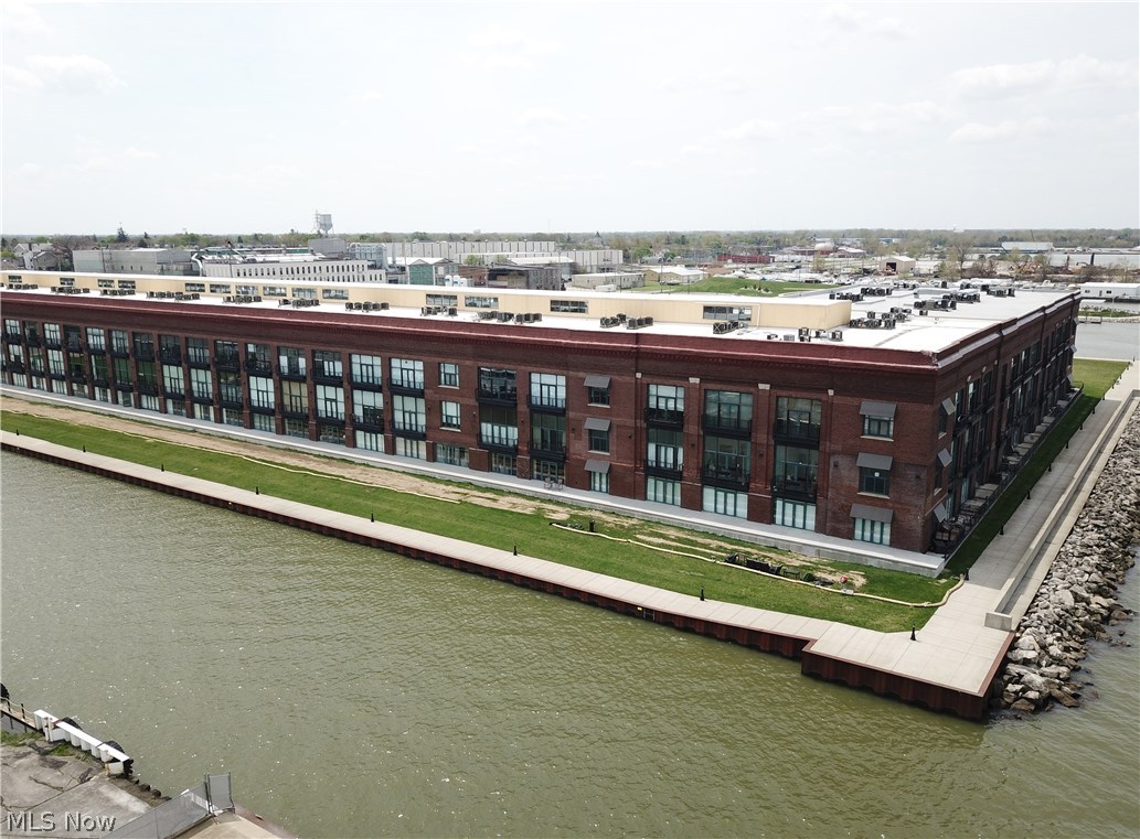 Stunning views of Cedar Point and downtown Sandusky from this prime first floor condo at the Chesapeake Lofts. North end location facing East and across from the fitness room. One of the best locations in Chesapeake. Open living room and kitchen areas that lead out to the NEW outdoor patio. Only first floor units have the 8' deep patios big enough for full patio set. Master bedroom with attached master bath. Maple cabinets and solid surface counter tops throughout. Being sold fully furnished. New hot water heater January 2019. Buy in to the lifestyle. Great walk-ability to downtown amenities including exquisite restaurants, a taphouse, micro-brewery, theater and summer events. This is a very rapidly growing area! Association offers elevators to each floor, work-out room, pool and laundry. Secured building and gated community. Garages available separately for sale or rent. Dockage available at city marina next door.