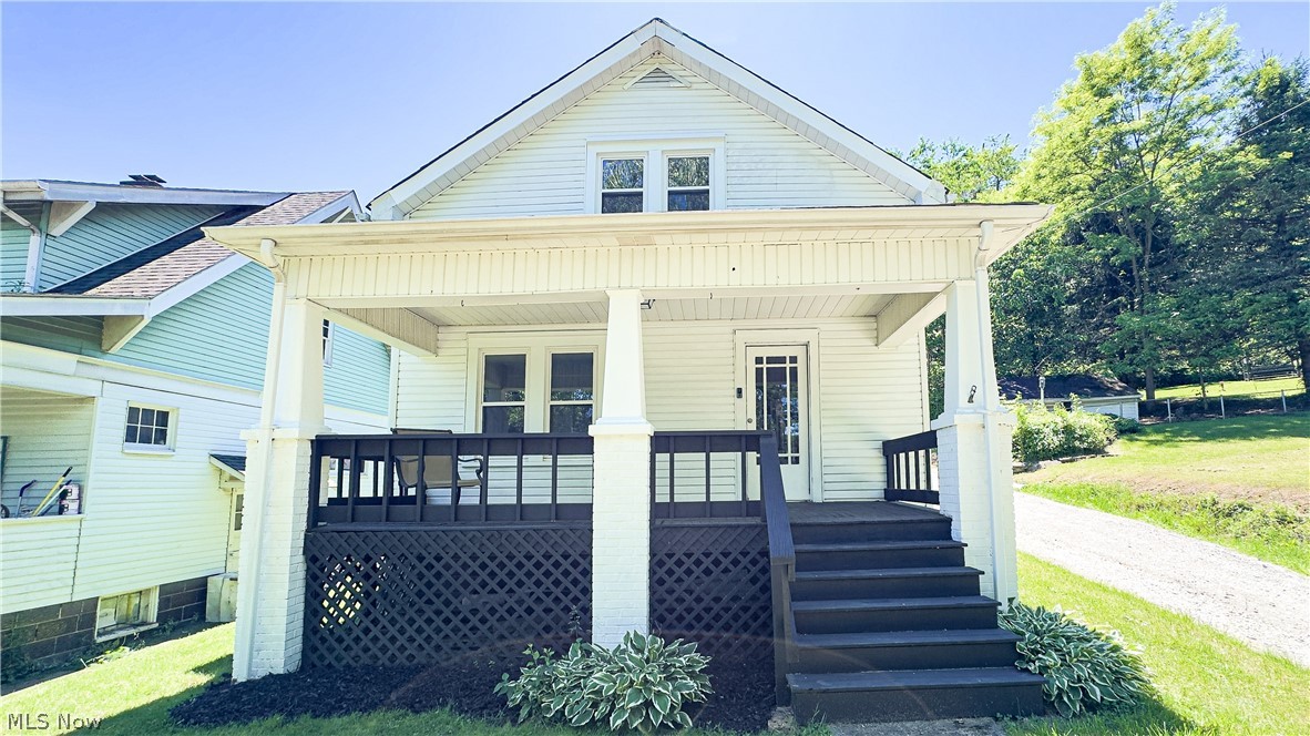 Welcome to this charming, move-in-ready 3 bedroom, 2 full bath home in a super convenient Steubenville location! Less than 2 minutes from the intersection of SR-22 and Route 7, and only FIVE minutes from the University, this home offers easy access for commuting, shopping, dining, and everyday errands. Inside, you’ll find fresh updates throughout, including new flooring, some updated light fixtures, beautifully updated bathrooms, and a fresh coat of paint in every room, as well as on the front and back porches. The main floor laundry adds extra convenience, and the eat-in kitchen comes equipped with the refrigerator and range, making your move that much easier. Outside, enjoy a large front porch that’s perfect for relaxing, plus a detached one-car garage for parking, storage, or hobby space. With its practical layout, charming curb appeal, and recent updates, this home is ready for its next owner to move right in and make it their own! If you’re looking for an updated home with convenience, charm, and no big to-do list - contact your Realtor to schedule your private tour today!