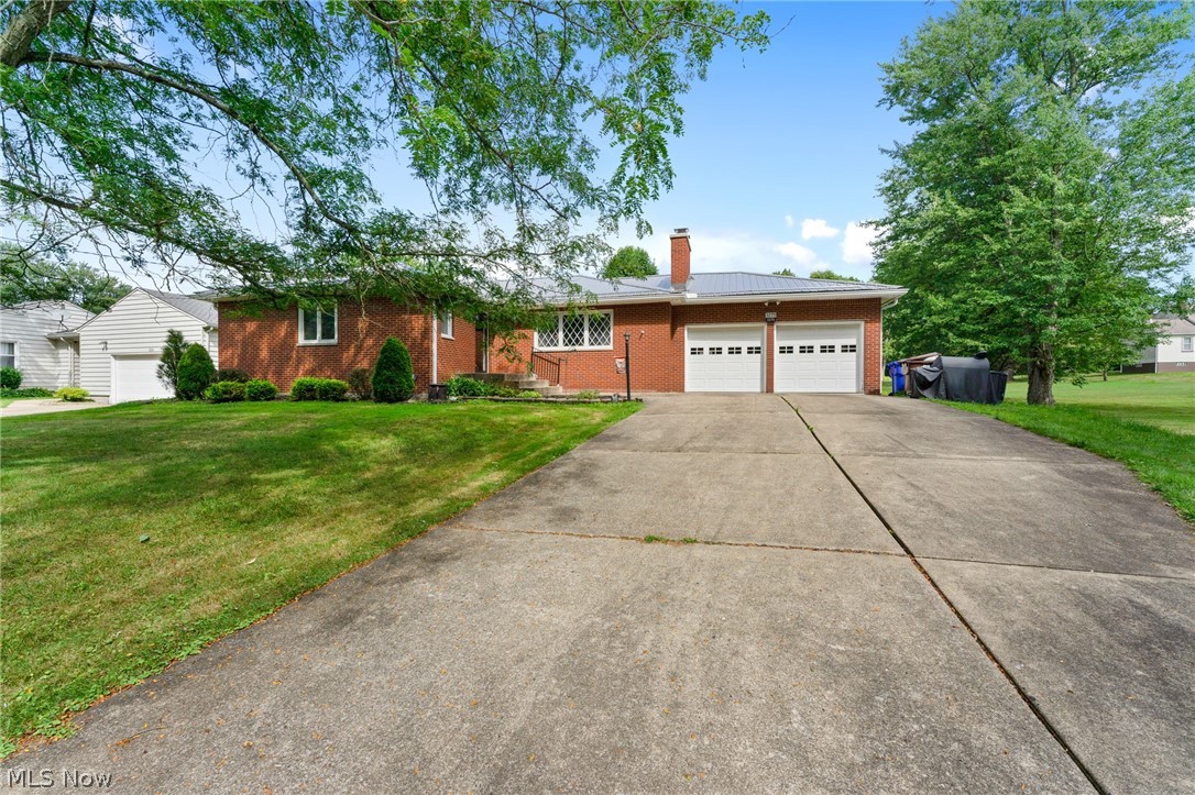Welcome to a solid BRICK RANCH right in Hubbard nested on almost .70 of an acre! This 3 bedroom 3 bathroom is ready for its next owner! The living room welcomes you into a large space with natural light and a beautiful brick fireplace that makes this room so cozy. The eat in kitchen has tons wood cabinets with lots of space and is open to the dining area. Three generous sized bedrooms with hardwood flooring throughout, Master offers a 1/2 bath and there's a full bathroom with a tub on the main floor. The basement has been professionally waterproofed and offers another full bath. This space can be finished for another living space with a brick fireplace that would add a lot of value! Updates include: New Metal Roof, newer Pella vinyl tilt in windows, high efficiency furnace and A/C, updated electrical service and 2 new garage doors with openers. Hubbard School District. Near pine lakes golf course! Do not miss out on this opportunity!!! This will not last!