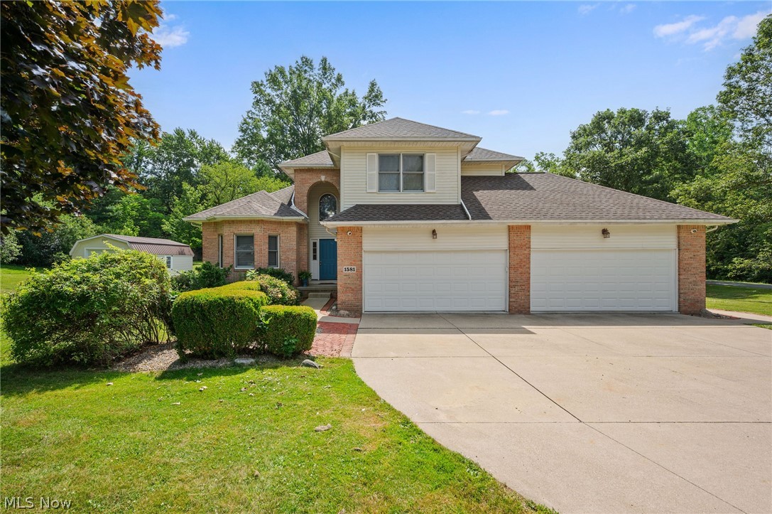 Located in Copley, just minutes from the town center and Fairlawn, shopping, parks, and entertainment, this home welcomes you with a vaulted foyer entry that flows into a dedicated dining area, a nicely appointed and recently updated kitchen, and a living room warmed by a gas fireplace. It has a spacious four car garage with bays deep enough to fit some full sized or light duty pickup trucks. From the garage entryway, you'll find a main-floor laundry room, a full bath, and a unique enclosed room perfect for a quiet home office. Upstairs, the primary bedroom features a remodeled en suite bath with a closet outfitted with custom organizer racks, and three additional bedrooms share a second full hallway bath. The partially finished basement offers two rec room areas plus a large unfinished space for storage or a workshop. The home is equipped with a state-of-the-art self-contained video security system. Outside you will find a large custom built shed, that is the perfect space for storage, or a workshop, a patio, and a metal gazebo. Notable updates and system ages include: brand new septic system (2026), hot water tank (2023), air conditioning unit (1999), furnace (2025), roof (2021),  finished basement area (2026), new carpet upstairs and on basement steps (2026), bathrooms remodeled (2025), master suite remodeled (2025),  whole house painted (2023), camera system (2023), premium vinyl flooring (2021), garage door (2021), gazebo (10x20, 2021), shed (14x24, 2021), extended concrete patio (15x45, 2020), kitchen updates (2019), first-floor office (2018), glass block windows (2018).
