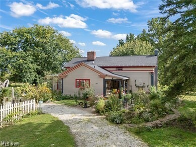This 1836 5-bed/2-bath Colonial has 2,746 sf of living space on 14 acres in Montville Township in the Medina City School District. Updates include newer roof (2018), updated electric, copper plumbing w/PVC drains, new windows throughout first floor & fresh interior paint in '23/'24 Geothermal heating/cooling, whole-house fan, hardwired security system, updated kitchen & bathrooms, dry walkout basement. Utilities: well water, water softener & reverse osmosis system, septic system (inspected & pumped - 2025) All buildings are serviced by single meter.  Outbuildings: detached 3-car garage built 2018, large bank barn w/electric, hot/cold water, 2 floors. Entirety of main level & rarely found, this sturdy barn has concrete floors with up to 10 horse stalls. Newly painted in mid-2022, other assets: 1-acre fenced pasture with plenty for future pasturing, fenced chicken coop sheltered & under roof, walking/riding trails and office.  Versatile, residential & recreational appeal & a plant lovers paradise w/hundreds of plant species thriving in 7 perennial flower beds, including a pond garden. Relax in the Six~person Hot Tub and ample shade of the backyard or enjoy the wide swing overlooking a lake view. Self-sustaining with apple and pear trees, raspberry, blackberry, blueberry and gooseberry bushes, multiple strawberry patches. Large, painted, wood-fenced & double-gated vegetable garden. Ride your horse or walk through the wildlife meadow paths, which become new with each season. Excellent location!  Whether for hobby farming, horse/bee keeping or event venue, the possibilities are positively endless! Meticulously cared for, updated and remodeled, you will find this home & property to be 100% “move-in-ready!”  Police, Fire & Ambulance services are just 800 yards from the driveway!!