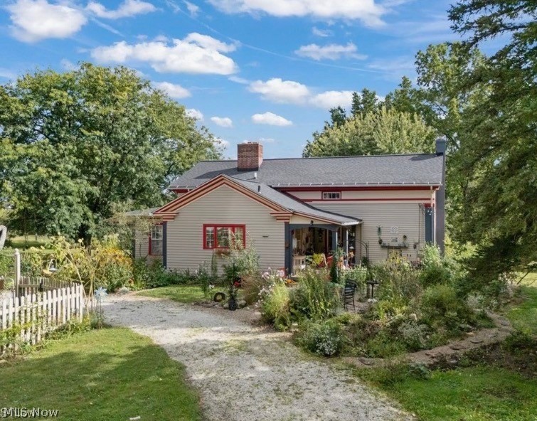 This 1836 5-bed/2-bath Colonial has 2,746 sf of living space on 14 acres in Montville Township in the Medina City School District. Updates include newer roof (2018), updated electric, copper plumbing w/PVC drains, new windows throughout first floor & fresh interior paint in '23/'24 Geothermal heating/cooling, whole-house fan, hardwired security system, updated kitchen & bathrooms, dry walkout basement. Utilities: well water, water softener & reverse osmosis system, septic system (inspected & pumped - 2025) All buildings are serviced by single meter.  Outbuildings: detached 3-car garage built 2018, large bank barn w/electric, hot/cold water, 2 floors. Entirety of main level & rarely found, this sturdy barn has concrete floors with up to 10 horse stalls. Newly painted in mid-2022, other assets: 1-acre fenced pasture with plenty for future pasturing, fenced chicken coop sheltered & under roof, walking/riding trails and office.  Versatile, residential & recreational appeal & a plant lovers paradise w/hundreds of plant species thriving in 7 perennial flower beds, including a pond garden. Relax in the Six~person Hot Tub and ample shade of the backyard or enjoy the wide swing overlooking a lake view. Self-sustaining with apple and pear trees, raspberry, blackberry, blueberry and gooseberry bushes, multiple strawberry patches. Large, painted, wood-fenced & double-gated vegetable garden. Ride your horse or walk through the wildlife meadow paths, which become new with each season. Excellent location!  Whether for hobby farming, horse/bee keeping or event venue, the possibilities are positively endless! Meticulously cared for, updated and remodeled, you will find this home & property to be 100% “move-in-ready!”  Police, Fire & Ambulance services are just 800 yards from the driveway!!