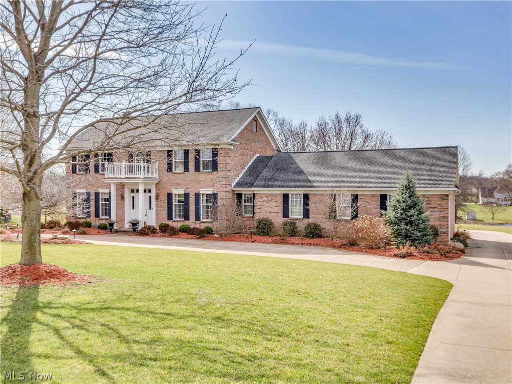 The circular drive leads up to this beautiful brick colonial w/unbelievable quality & amenities while situated on 1.24 acres w/water view* This home boosts 4 bedrooms, 2.5 baths, approx. 3754SF incl finished lower level plus vaulted sun room overlooking tranquil back yard w/composite deck, paver patio w/built in fire pit & built in seating* Many fine features includes extra wide crown molding, 6 panel oak doors, oak floor (foyer, living rm & dining) & wainscoting (formal dining rm), Bayed designer kitchen (2004) w/wood mode cabinets, granite counter top, ceramic/glass back splash, island, desk, ceramic floor, fully applianced & eating area w/Pella slider to sun room* Family room w/window wall/atrium door w/access to deck & floor to ceiling brick fireplace w/hearth & mantle* Living room adjacent to family room w/French pocket doors*  1st floor laundry w/cabinets, closet, ceramic floor & access to half bath* 2nd level w/vaulted master with double door entry, walk in plus extra closet* Up