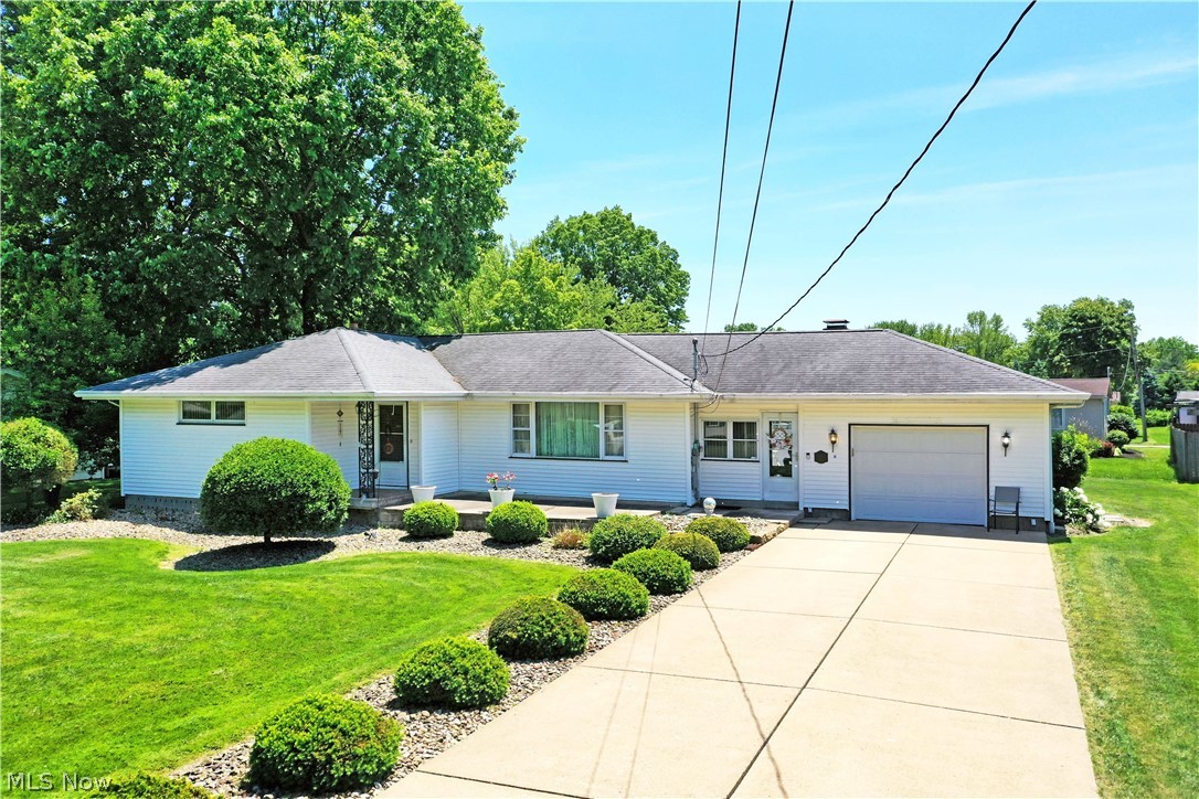 Cozy and charismatic, this well-loved Niles ranch is making its first appearance and it’s one you won’t want to miss! Delightfully engaging from the outside in, the handsome home offers up plenty of curb appeal that helps it stand out from its peers. The cement driveway is lined with stone and manicured shrubbery that continues along the sidewalk, breezeway, and formal entrance. Around the back, a privacy fenced lined patio space ensures you can relax unbothered. Through the front door, a closet adorned foyer opens to a spacious living room where large windows introduce plenty of natural light, warming the plush carpets below. Around the corner, the gracious central dining room enjoys rich, hardwood styled flooring before transitioning to stone-like tiles in the kitchen. A multitude of wooden cabinets allow for easy storage, contrasting the piano black appliances. Down the main hall, a brightly painted bathroom showcases sleek tilework throughout. It joins a trio of impressively sized bedrooms that branch from the winding hall. Completing the first floor, a must-see breezeway includes a fireplace; perfect for entertaining and casual relaxation alike. Laundry services, storage and provisions for a full lower bath cab be found at the basement level. Electric service, hot water tank, air conditioning updated within the last 10 years. Selling AS IS.