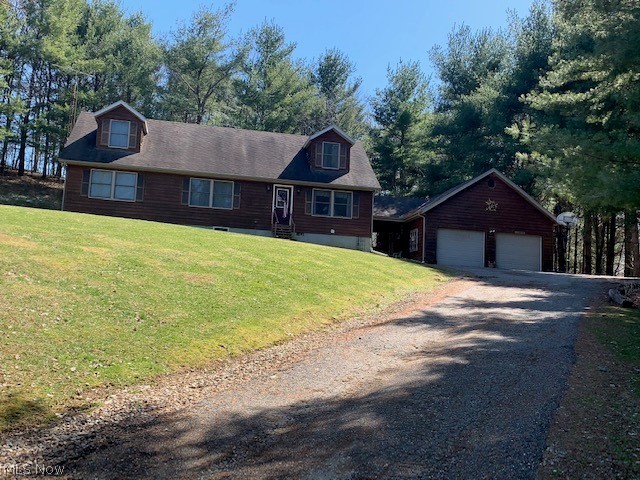 Come fall in love with this charming cedar-sided Cape Cod home situated on 5.001 acres. Enjoy the sights and sounds of nature relaxing on the back deck. The first floor offers the living room which is open to the kitchen, dining room with patio doors to the outside deck, laundry, one bedroom and master bedroom with full bath. Large kitchen with beautiful new flooring, island/bar area and plenty of cabinet space. Upstairs are 2 more large bedrooms with built-in storage/dressers, a full bath and extra large closet. Easy to finish, very open and spacious walk-out basement with already a full bath and beautiful tile shower. Go through the breezeway to the large detached garage with loft area for more storage. Won't last long so schedule for your private showing today.