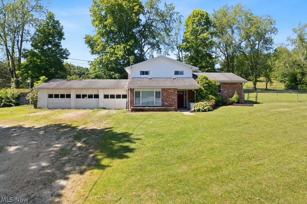 Three levels, three garage bays, and more than half an acre of possibilities.

This remodeled tri level was designed for real life, with spaces to come together when you want to and room to spread out when you don't. Step inside the entry foyer and head up to the main living room, a comfortable gathering space that flows into the dining area at the heart of the home.

Just off the dining area, the updated kitchen features refreshed cabinetry, updated countertops, and a mix of stainless steel and black appliances. Sliding glass doors lead to a bright enclosed room filled with potential as a sunroom, hobby space, home office, or future all season retreat.

The lower level offers additional living space with a family room, a full bath with a shower, and a laundry room with storage. From there, you'll find access to the oversized three car garage, providing plenty of room for vehicles, equipment, hobbies, or extra storage.

Upstairs, the primary suite includes its own bath and walk in closet. Hidden within the closet is a tucked away bonus storage area waiting to be discovered. Two additional bedrooms and a second full bath with a tub complete the upper level.

Situated on a corner lot of more than half an acre, the outdoor space offers room to enjoy the seasons, entertain, garden, or simply unwind. A line of trees along one side creates a natural backdrop, while the remodeled interior and versatile layout make this property ready for whatever comes next.