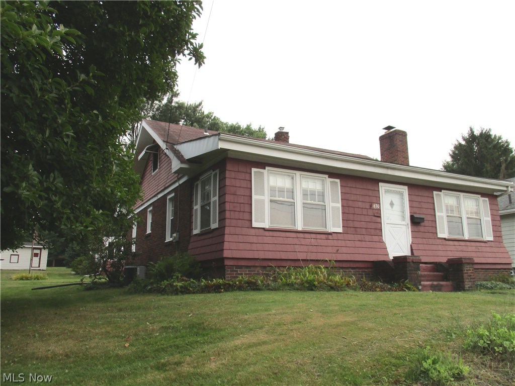This home has 4 city lot.  (Approx 0.68 of an acre.) Conveniently located across the street from Trails End Park...This 3 Bedroom Bungalow has a large eat-in Kitchen, Living room with Fireplace, enclosed front porch.... Large 2 car garage with enclosed patio room w/ wood stove.