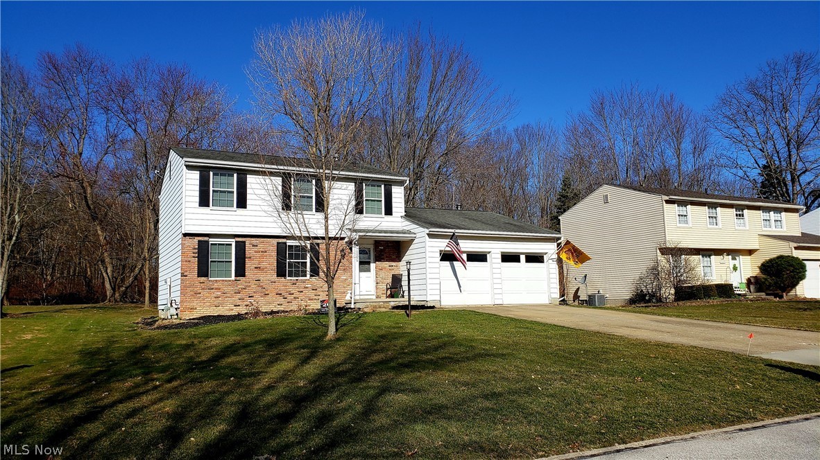 Lake life! Start living like you're on vacation! COMPLETELY updated 3 bdrm colonial situated against the woods of the Twinsburg Metroparks with walking trail just beyond the property line! Everything new from top to bottom!New windows with 20 yr warranty ('19). New roof with 30 yr warranty ('19). Complete kitchen remodel in 2011. New cabinets with soft close doors, undermount sink, granite counters,  breakfast bar, & all new stainless steel appliances including double oven & french door fridge. New luxury vinyl "wood plank" flooring throught kitchen, hallway, and first floor bath ('11). New carpet in family room ('11). Recessed lighting, baseboards, & crown molding ('11). New electric panel, switches & outlets ('11). New wood burning stove & tile surround ('11). New sump pump ('11). New garge door ('11). New front door ('11). New furnace, A/C & thermostat ('11). Both bathrooms completely remodeled in 2011 & 2019.  New 23' x 15' deck & shutters ('17). New washer/dryer ('18). 305 acre la