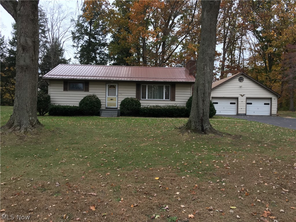 Looking for a ranch home close to town but want that country road setting, then this is the house for you! This well taken care of two bedroom one bath home rests on just over an acre of land. The home has a great over-sized eat in kitchen with plenty of room to entertain guests. The family room has great light with the large picture window and a cozy fireplace with new carpet. The bedrooms have new carpet also and a nice amount of closet space . The basement is ready to be converted into extra living space or exercise space and provides that extra room if needed. This home has an over-sized two care garage with extra storage above and two extra workshops off the back that provide enough room to park that antique care for the winter if needed. The home also has a newer metal roof, furnace, and brand new electrical box. All of this on an acre of land in a great location. If your looking for that home near the lake to park your boat and go fishing or looking to downsize to a smaller ranch home then this is the place for you!