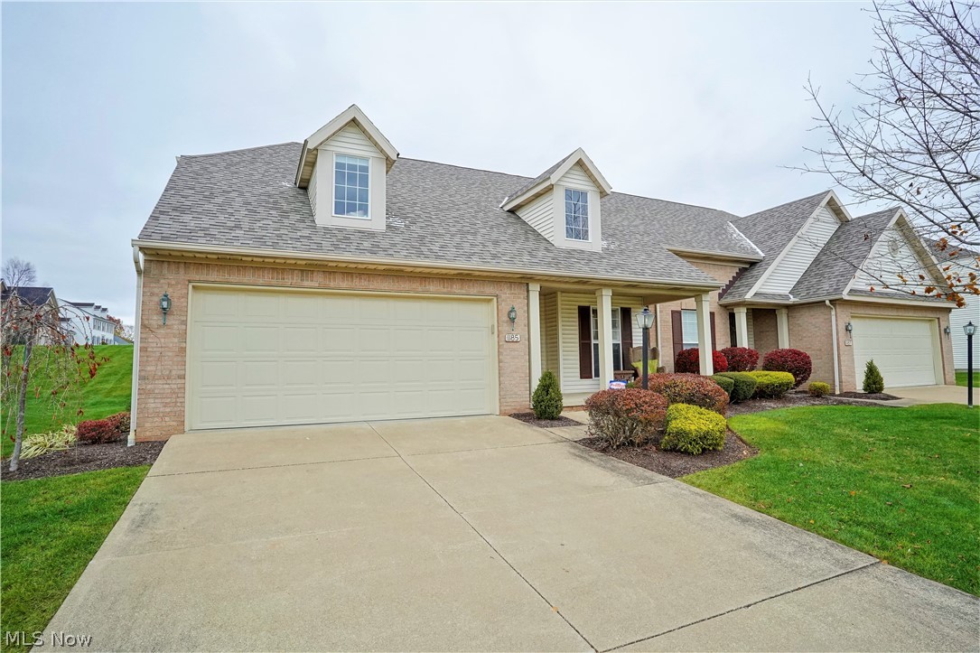 Feel the warmth and love when you walk in the front door of this super nice contemporary condo!  This home features an open floor plan with vaulted ceiling in the great room/dining area, gas fireplace for the cold nights and flows into a family/sun room with access to the nice deck and view.  There are many windows that allow for an abundance of light!  The eat in kitchen offers plenty of cabinet and counter space (all appliances convey).   First floor master suite features 
a 7 x 6 walk-in closet with professional organizers  and the master bath has a double vanity with  beautiful recently updated tiled walk in shower.  The first floor laundry (washer and dryer also convey) has a convenient folding counter and was organized for efficiency.  Updated half bath completes the first floor.  The second floor features an amazing loft, which is the perfect office, full bath and the spacious bedroom has amazing built ins.  Be sure to push in the wall bookcase to discover a newly finished walk