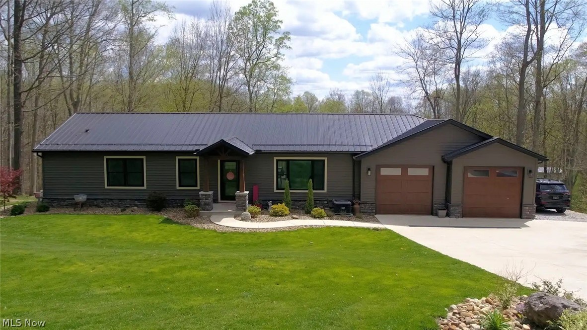 Tucked away in the desirable Lake Buckhorn community and just minutes from the main and north gate, this beautifully maintained ranch-style home offers the perfect blend of comfort, convenience, and space for entertaining. Featuring 4 bedrooms and 3 full bathrooms, the home welcomes you with a functional layout and a fully finished walkout basement designed for gathering with family and friends. Step outside to enjoy a spacious vinyl deck (2018) and stamped concrete patio (2019), complete with a hot tub (2020) and a Blackstone grill (2020) converted to natural gas that both convey—creating the ultimate outdoor retreat. Thoughtfully updated throughout, this property includes a 2020 metal roof, 2021 siding, windows, ProVia doors, gutters, and garage doors, plus a waterproofed basement (2019), whole house generator (2023), and newer driveway (2023) for added peace of mind. A 2-car attached garage and underground wireless dog fence complete this impressive package. No need to buy kitchen appliances as they all stay with the home: stove (2024), dishwasher (2024), fridge (2025), and a bonus fridge and dishwasher in the basement. This home is truly move-in ready and designed for easy living, both inside and out!