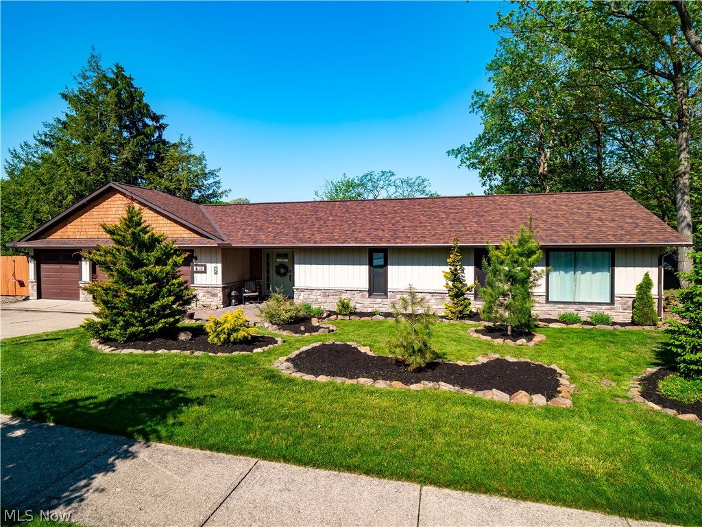This custom "re-imagined" Ledgewood Ranch home is simply spectacular!  Boasting over 3600 sq ft, it's like two separate homes...in one! Perfect for extended family, in-law suite & more. Directly through the front door, off the impressive foyer area, is a current in-law suite!  Suite includes one bedroom, one full bath with full granite kitchen and all appliances, dining room and living room area.  A future washer/dryer could be put in front closet - not needed for current owner.  Past the foyer, a cute den/lounge area is a favorite family game night spot!  A few steps down into the main home, you'll find 3 bedrooms (one spacious master bedroom with impressive master bath and walk-in custom closet) and two additional bedrooms, shared full bath and laundry room.  The gorgeous open-concept kitchen, dining room & great room areas showcase vaulted ceilings, Hand-hewn beams and red river hickory flooring.  The kitchen comes with all appliances, gas cook-top and pot filler!  The great room focal point is gas fireplace wall.  Nestled in the center, a nice dining area- simply a home made for entertaining.  Custom glass doors add a cozy feel to the sunroom and allow for a more private office space at the rear of the home.  Outdoors, an expansive covered stone paver patio, a private patio off master bdrm, private deck off the suite up front.  This home was completely remodeled in 2021 and the remodeling and upgraded finishes kept coming!  A generous list of updates and special features is available. 30 solar panels , a Tesla power wall with 2 batteries/Level 2 charging station, were installed in 2022.  Benefit from very low electric bills and security during power outages. Yard is fully fenced (recently stained last season) and a three car attached garage affords lots of storage!.  New landscaping & retaining wall in front yard ('24). This incredible home is simply a must see.  Truly a one-of-a-kind in Ledgewood and a 2 min walk from front door to community pool & clubhouse!