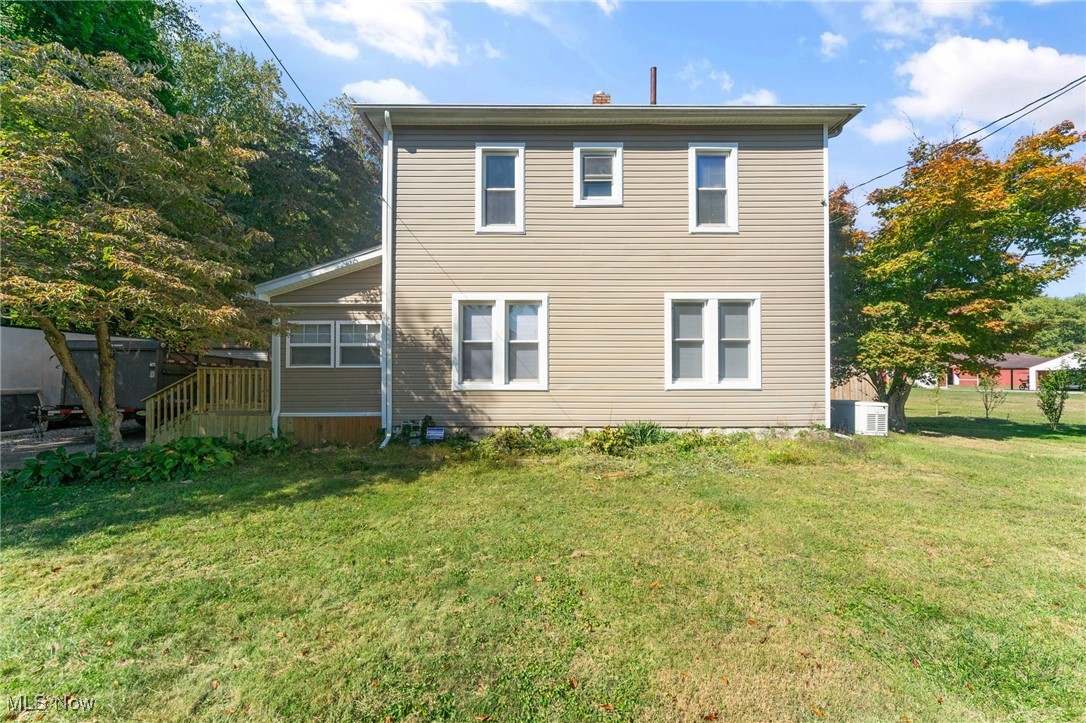 Move right into this beautifully remodeled 3-bedroom home with the potential for a 4th bedroom in the finished basement, offering 2 full bathrooms and plenty of updates throughout. The exterior shines with excellent curb appeal featuring newer vinyl siding, a dimensional shingle roof, a brand-new side deck, a back deck overlooking the yard, and a newer 2-car steel garage. Inside, the side entry leads into a spacious living room with fresh laminate flooring and a stunning electric fireplace accented with tile. The eat-in kitchen is a showstopper with granite countertops, subway tile backsplash, solid wood cabinets, and stainless-steel appliances. A versatile back area can serve as a dining space with direct access to the deck, while the main floor also offers a full bath with vaulted ceilings, a tiled walk-in shower, new vanity, and updated fixtures. Upstairs you’ll find three bedrooms with new flooring and a second remodeled bathroom featuring a tub with tiled walls, new vanity, and toilet. The basement provides additional living options with a finished room perfect for a playroom, office, or bedroom, plus tile flooring, a laundry area, and plenty of storage. Major mechanicals include a brand-new septic installed Oct 2025, high-efficiency furnace and central air, hot water tank, and 100-amp panel. Located in the desirable Hubbard School District, this home is completely move-in ready and waiting for its new owners