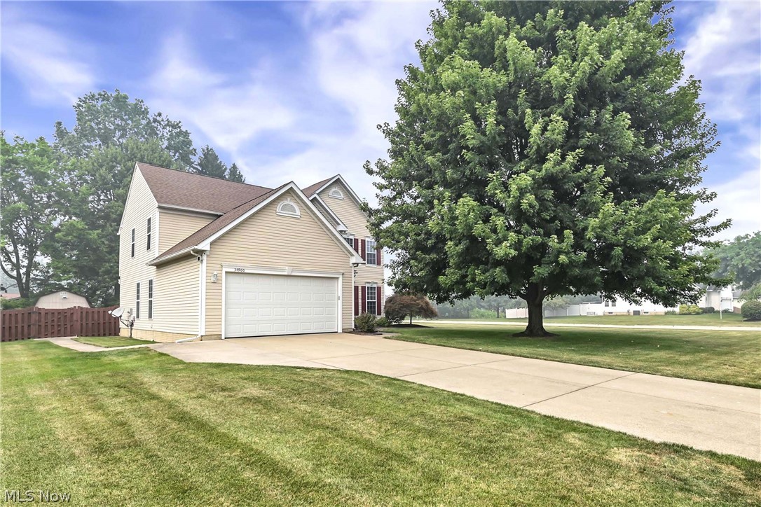 Welcome to 34900 Clear Creek Dr, a well-maintained 5-bedroom, 3.5-bath home nestled in a desirable North Ridgeville neighborhood without a HOA. The main level has crown molding and 9' ceilings  throughout.  Has a spacious formal dining room and large living room, while the family room features a gas fireplace and ceiling fan.  The updated eat-in kitchen is the heart of the home, showcasing quartz countertops,  recessed lighting, appliances, a huge pantry, large island,  slow-close cabinetry, and slider leading to a 3-season room with ceiling fan. A half bath and laundry room with closet and cabinets complete the main level.    

Upstairs, the owners suite features a spa-like bath with double vanity, stand-up shower, and a spacious walk-in closet. Four additional bedrooms all have ceiling fans but one and a full bath complete the second floor.                                                                                                                      

The large finished basement offers a dry bar and plenty of space with endless possibilities plus it has an additional bedroom with complete full bath and glass block basement windows.    
   
Outside, enjoy a patio, privacy wood fencing  with a Lawn Irrigation Sprinkler System (10 zones). The 2-car garage includes attic storage with pull down steps. With lots of recent upgrades, this move-in ready home is a must-see.
