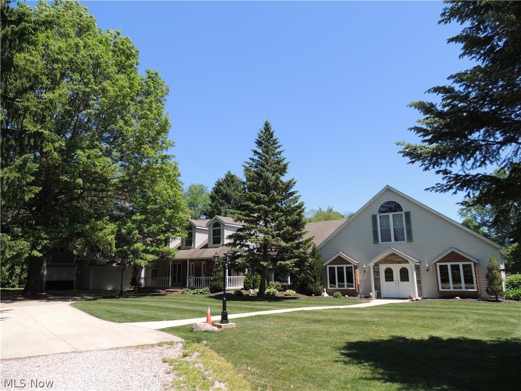 Property has 6+ acres and is zoned residential or commercial. Custom built quality throughout the home. Huge 24x16 sun room with windows galore that face a waterfall with bridge for your enjoyment. Lovely 13x11 library with accented wood ceiling and fireplace. All oak cabinets in the large kitchen with additional 10x9 eating area that highlights a lighted tray ceiling and chandelier. Extra large living room with built-in wood cabinets & a bay window. Spiral staircase. Master bedroom with glamour tub and walk in closet. Den with fireplace and wood floors. Large additional living suite. Barn with 1 car garage door. Ten minutes or less to EMH hospital. Less than 5 minutes to RT 10/I-480 & 15 minutes to the turnpike.