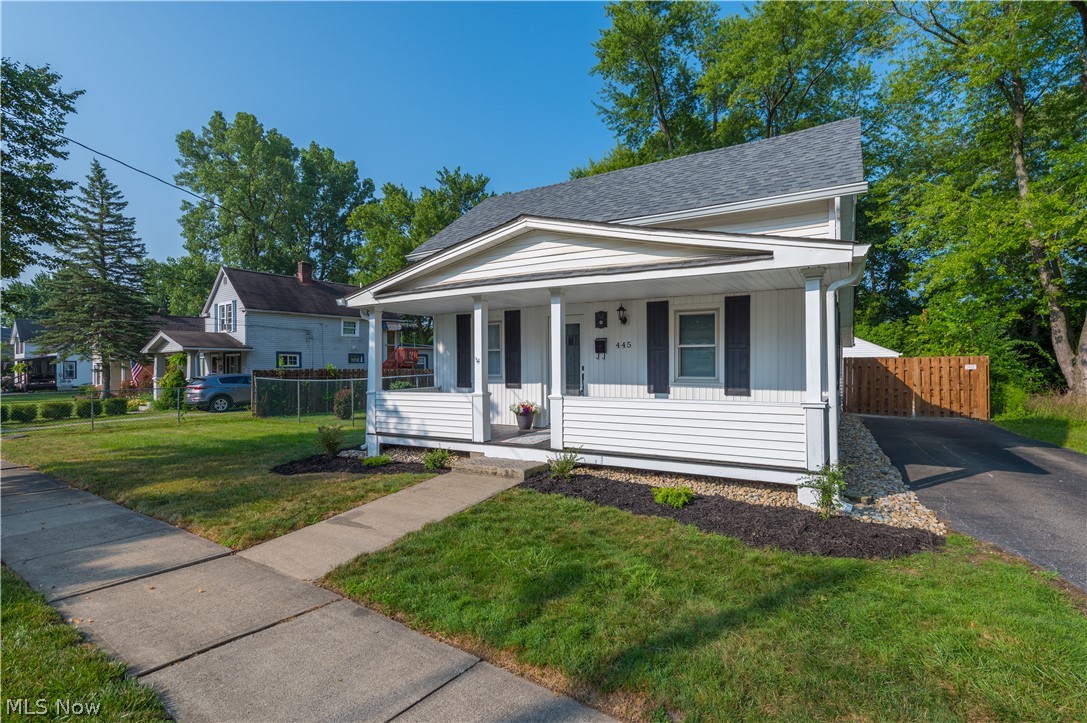 Welcome home to this beautifully restored historic gem in the heart of desirable Berea, Ohio! Thoughtfully remodeled from top to bottom, this charming 2-bedroom, 2-full-bath home perfectly blends timeless character with today's modern conveniences. Offering approximately 1,100 square feet of living space, this home features luxury vinyl plank flooring throughout the first floor, a home office/flex room, and a stunning, a completely renovated kitchen with custom cabinetry, granite countertops, and a full stainless steel appliance package. Both full bathrooms have been tastefully updated. The primary bath includes a convenient laundry area with a brand-new washer and dryer that stay with the home. The second full bath, located adjacent to the office/flex room, features a new vanity and a tub/shower combination, creating an ideal guest suite or private workspace. Upstairs, new carpeting leads to the spacious primary bedroom, complete with two oversized closets offering exceptional storage. Just off the kitchen, an additional bedroom and a finished sunroom provide the perfect place to relax while overlooking the beautifully landscaped backyard. Step outside to enjoy the new concrete patio,ideal for entertaining. The oversized lot offers plenty of room for gardening, recreation, or future possibilities, while the detached one-car garage adds convenience. Additional updates include, new roof, garage floor,HVAC, Electrical(permitted) and plumbing(permitted).