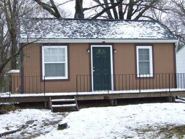 Can you say NEW?!  2 Bedroom Ranch with updated kitchen, bath, carpet, linoleum, paint, lights, cupboards, counters, brand new kitchen appliances.  All freshly painted-inside and outside.  Newer winds, doors, screens, roof, boiler, insulation.  Partially finished rec room with small walk-out door.  Large, detached 3-car garage, perfect to store business supplies or car buff's dream (steel I-Beam runs across center). Small but efficient!!  Dead-end street.