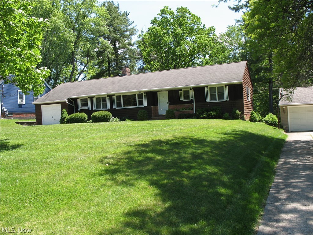 An opportunity that does not come along often to get into North Royalton at this price! This light and airy, well laid out ranch is situated on over ½ an acre with gorgeous views on a dead-end street. It has an attached one car garage with plenty of shelving. The eat-in kitchen is right off the garage and features updated cabinets and a pantry for plenty of storage. The electric range and refrigerator stay! The great room is conveniently right off the eat-in kitchen and is very spacious with gorgeous views from the front and back windows. French doors lead from the great room to an office area that features a window with breathtaking backyard views. The 3 bedrooms all have hard wood flooring. Windows are all updated and many of them are Pella! Home features a partially finished basement with a wood burning fireplace and another room with closet, both carpeted. The driveway features extra room to park for entertaining guests. The basement also features a full bathroom! Schedule an appointment to see this solid home before it's too late!