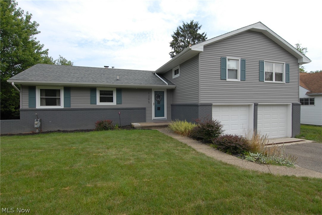 Immediate possession is available on this move-in ready Military Rd. address! Step inside this 3 bdrm, 1.5 bath bi-level, and let the stress of the day fade away.
A spacious eat-in kitchen, with a door to the side yard, offers views of the greenery of the Zanesville Country Club across the road; most of the cabinets have been child-proofed for peace of mind; the first-floor family/dining room stretches across the back of the home and has access to the rear concrete patio and backyard. Uni-Shield replacement windows grace the majority of the home. An over-sized two car attached garage has ample storage room; access to the basement and to the backyard! The paved driveway and paved semi-circular turn around, add safety and curb appeal at the same time! The side and backyard will provide you lots of outdoor possibilities. Right in the heart of everything North, this Military Rd. home is ready for you!