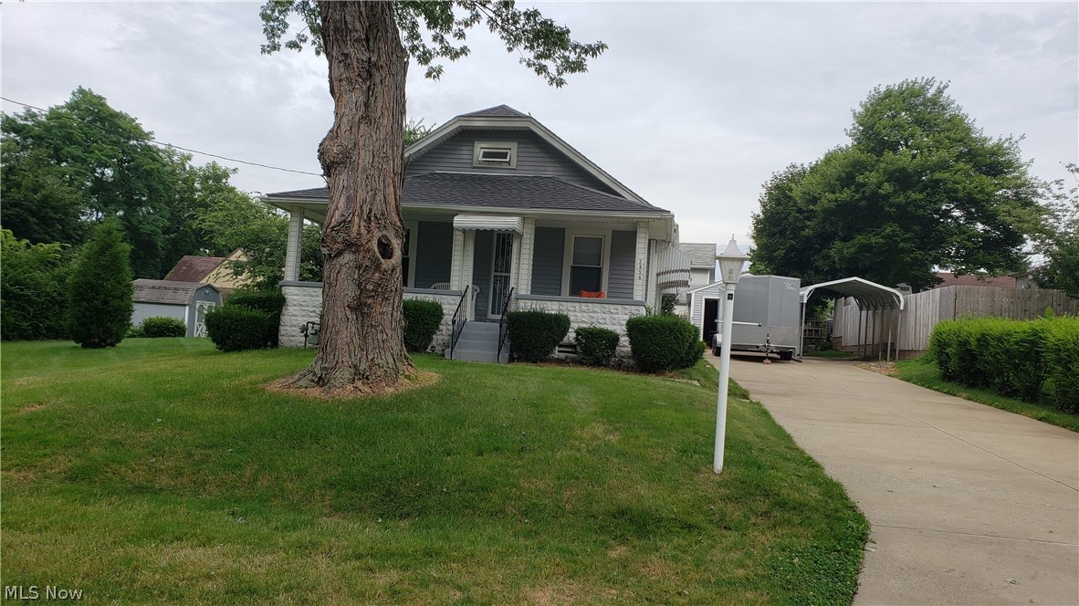 2854 Denman Drive .Perfectly located in a quiet neighborhood just minutes from the world famous Portage Lakes or the Highway and the city. Pull on up the bright white cement double driveway and park in your choice of the oversize 1 car garage or the carport (that stays) Take 3 small steps up the large solid concrete steps to front porch country living on the swing and admire the  beautiful lawn on this extra large double lot with beautiful landscaping just waiting to be enjoyed. Front door opens to brand new carpet and paint in the living room and throughout so come in and see what little touches you might make to call this your home. Clean dry basement with extra room used as bedroom for many years. Some of updates include Vinyl siding, roof, windows, glass block. Immaculate Home you will not be disappointed!! Just bring your imagination and make it your own.