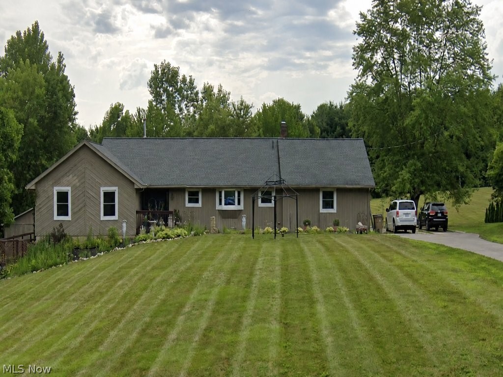 Exceptional custom ranch offering over 5,300 square feet of finished living space on a beautifully landscaped lot in Medina. Designed for flexibility, this home features 8 bedrooms, 4.5 baths, and two fully equipped kitchens, making it ideal for multi-generational living, extended guests, or a variety of lifestyle needs. The main level offers spacious living and dining areas, hardwood flooring, luxury tile in the updated kitchen, abundant cabinetry, and generous natural light. The finished walkout lower level has been completely remodeled with new cabinetry, granite countertops, appliances, and a full kitchen, plus an ADA-accessible bathroom, walk-in therapeutic tub, and 36-inch doorways. Recent improvements include replacement windows, waterproofed lower level, new 50-gallon water heater (2026), updated pool liner and pump (2022), hardwood flooring, luxury tile flooring, and concrete patio improvements. Enjoy summers around the 22,000-gallon above-ground pool with expansive surrounding deck. Additional features include a 3-car attached garage, detached outbuilding with new windows and garage door ready for installation, Culligan water softener, and regularly serviced well, septic, and HVAC systems. Conveniently located near shopping, dining, parks, and major commuter routes. A rare opportunity offering exceptional space, versatility, and value.