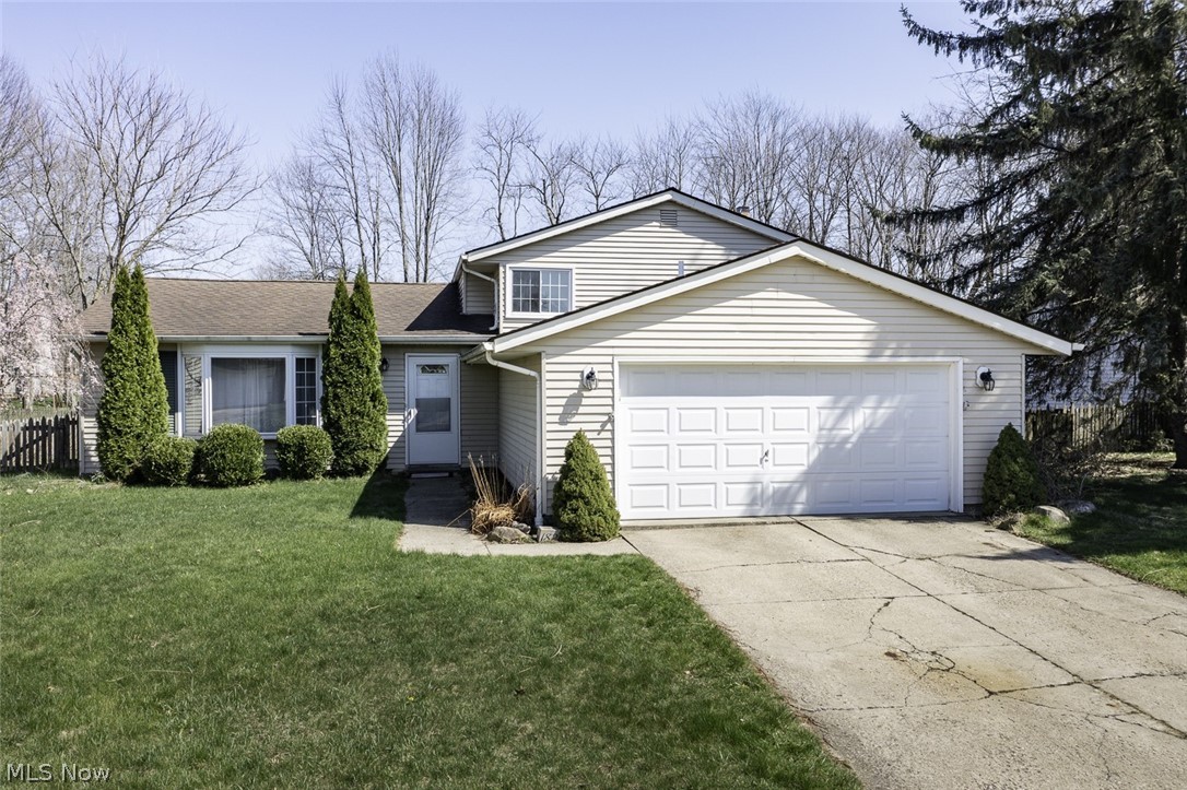 Beautiful split level on .30 acre fenced lot. Walk into the open foyer with wood tread stair and newer railing leading to upstairs. It opens to the formal living room and dining room with vaulted ceilings. Most windows are newer with transferrable warranty, redone in 2016. The kitchen is open to dining area and has a slider that opens to backyard and patio. Lower level family room has a gorgeous stone woodburning fireplace. The oversized laundry room has room for storage. There is a full bath off the laundry room. Upstairs there are three generous sized bedrooms and a full bath. There are many updates in the home; hot water tank 2017, new attic insulation 2022, chimney crown 2019, HVAC 2018, shed 2019, electric updated 2018, radon mitigation system 2022, interior doors approx 8 years. Attached 2.5 car garage has pull down storage. Come check it out today!