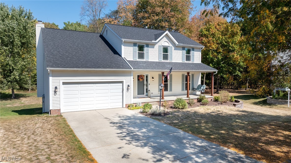 Exceptionally updated and meticulously maintained colonial available in Tallmadge! Welcoming covered front porch invites you into the homes spacious interior.  Flanking the foyer you'll find a large formal living room (currently used as an office).  The living room opens to the stylish formal dining room.  Off the dining room you'll enjoy a stunning updated kitchen with high end soft close cabinets,  granite counters and stainless appliances.  Kitchen opens to to a lovely family room with a fireplace, offering plenty of space to gather and entertain.  French doors in the kitchen lead to an expansive back deck overlooking a private  back yard with plenty of room to run around and woods beyond. Back inside, a conveniently located half bath finishes off the first floor.  Upstairs you'll fins a massive primary suite complete with a huge walk in closet, and gorgeous en suite bath with a separate shower and soaking tub.  Down the hall are 3 very good sizes bedrooms all with great closet space, and an additional guest full bathroom.  Impressive lower level with full sized windows include a comfortable rec room and a huge 5th bedroom with a walk in closet.  The lower level also offers a great amount of storage and laundry room.  Updates throughout the home including all new 3 pane UV blocking windows and front door in 2022, water tank in 2025, new roof 2022, new HVAC in 2019, new gas range in 2025. Property is situated in a beautiful residential neighborhood at the end of a charming cul-de-sac.  Nothing to do but move in! Dont miss it!