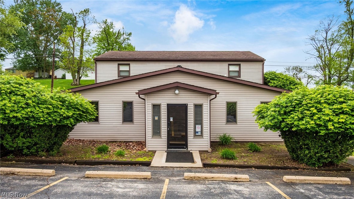 Dreaming of running your business from an incredible space? The possibilities are endless with this versatile mixed-use property! Ideal for a med spa, medical office, wellness studio, tattoo parlor, boutique, salon, and more, this property offers exceptional visibility and accessibility in Zanesville’s desirable north end, just minutes from shopping, restaurants, and Genesis Hospital.
The main level features approximately 1,600 square feet of thoughtfully designed commercial space, including a welcoming reception/waiting area, three treatment rooms, kitchen, three half baths, and a private office with an ensuite half bath. ADA accessibility, new flooring, and updated windows make the space move-in ready for a variety of business opportunities.
Upstairs, the separately accessed second level offers approximately 960 square feet with a two-bedroom, one-bath apartment. While cosmetic updates may be desired, the unit presents an excellent value-add opportunity for rental income or an ideal live/work arrangement for an owner-occupant.
The property also includes 12 parking spaces, providing convenience for clients, tenants, and staff. Currently zoned commercial, with a variance in progress for duplex use, this property offers outstanding flexibility and potential for investors, business owners, and entrepreneurs alike.