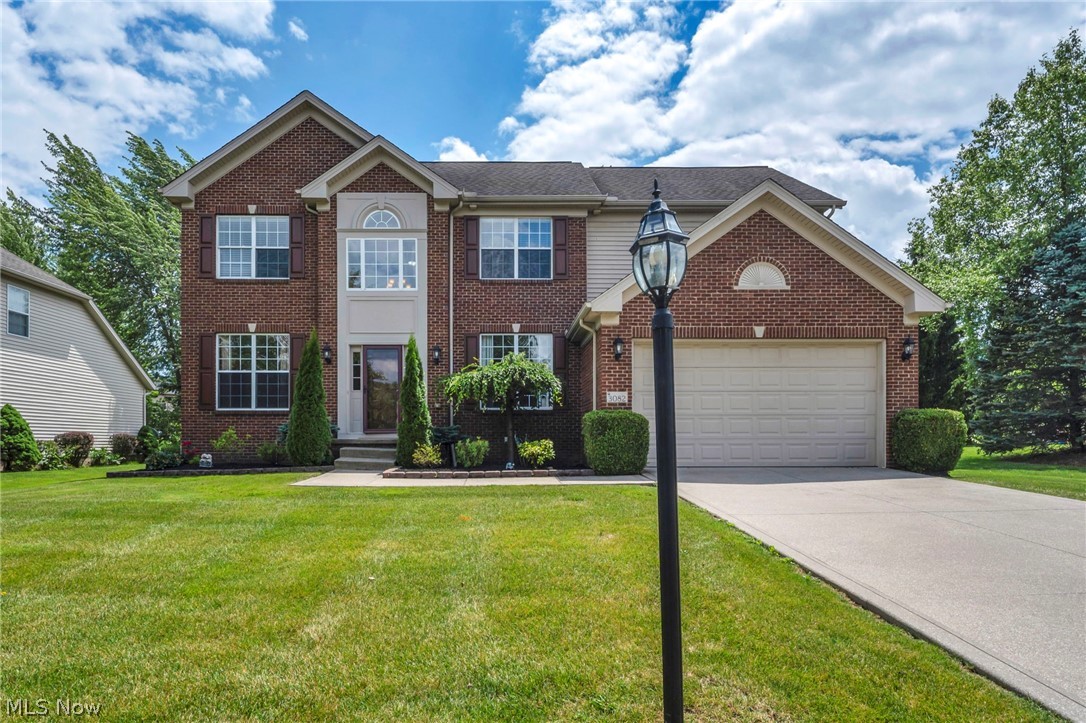 Welcome to this beautifully maintained colonial offering an ideal blend of elegance, comfort, and functionality. A dramatic two-story foyer opens to a spacious, open-concept floor plan highlighted by a stunning floor-to-ceiling stone gas fireplace and abundant natural light throughout. The well-appointed kitchen flows seamlessly into the main living areas, making it perfect for both everyday living and entertaining. 

The first-floor owner’s suite provides convenience and privacy, featuring dual walk-in closets and a luxurious en-suite bath with soaking tub and double vanities. Additional first-floor amenities include a dedicated office/flex room, formal dining room, laundry room, and direct access to the attached garage, which is equipped for an electric vehicle charging station.



Upstairs, you’ll find three additional bedrooms, a full bath, and an expansive bonus room overlooking the main living space. Architectural details including crown molding, chair rails, and custom millwork add character and charm throughout the home. 

Step outside to enjoy the beautifully landscaped backyard featuring a spacious deck and a remote-controlled retractable awning, creating the perfect outdoor retreat for relaxing or entertaining.