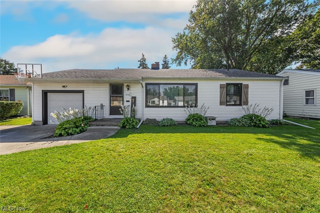 Welcome to this charming three-bedroom ranch-style home in Lorain, Ohio! With its farmhouse-inspired details and desirable features, this property offers a cozy and inviting atmosphere. The kitchen boasts a butcher block counter, adding to its farmhouse charm. Hardwood floors flow throughout the home, complemented by an electric fireplace and adorable wooden accent wall in the living room. The full basement provides ample storage space. Move right in and enjoy the fully fenced backyard, offering a private and serene environment.

Updates include brand new Renewal by Anderson windows, a 1-year-old furnace and AC, and a roof estimated to be around 10 years old. Appliances, including a new gas stove, stainless steel fridge, dishwasher, and washer dryer, are included. The farmhouse sink in the kitchen adds a touch of elegance.

Located in Lorain, Ohio, this home is close to various hotspots. Explore the nearby Lakeview Park with its beautiful beaches and stunning views of Lake Erie. Take a stroll through downtown Lorain, known for its charming boutiques and specialty stores. Immerse yourself in history at the Lorain Historical Society's Carnegie Center. Enjoy the outdoors at the Black River Reservation or one of the many Lorain County Metro Parks.

Don't miss the opportunity to make this adorable ranch-style home yours. Schedule a showing today and experience the best of Lorain, Ohio living!