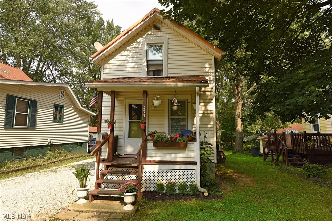 Nicely remodeled two-story in downtown Ravenna.  New kitchen cabinets, flooring, countertops and appliances.  An Addition of a bedroom, full bath, and laundry room on the first floor.  Second story with a second bedroom and a full bathroom.  Private backyard complete with moveable shed and garden area. One-year home warranty included.