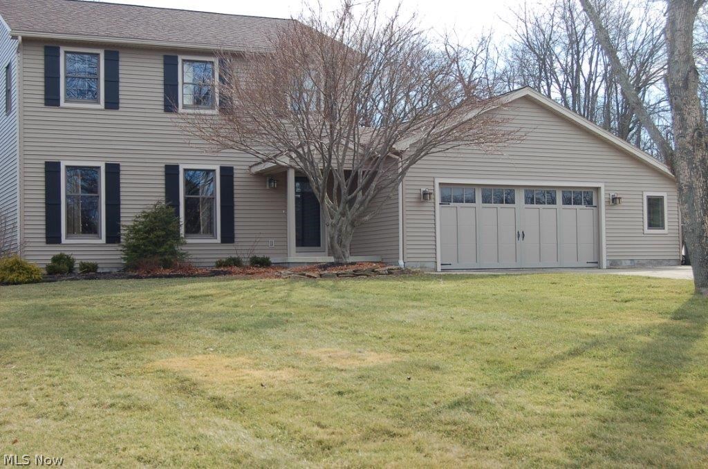 This completely updated home is situated on a 1 acre lot.  It boasts a new kitchen "2014", stainless appliances, dark maple cabinets, maple flooring that opens to a large family room with wood burner, interior has been painted in earth tones, family bath is totally remodeled, additional baths have been updated.  The beautiful sun room opens to a new paver patio, new retaining wall, landscaping 2013, a 24x40 out building with electric. Zoned heating, mud room is plumbed for laundry.  Cul-de-sac street.  A home warranty is being offered.  The home has new roof 2013, siding and gutters in 2014, new front porch and front door 2014.  Canfield township, Boardman schools.  Out building can be used for storage or recreations, or additional garage.  Gas & electric available for dryer, new well pump 2012, Culligan softener system.  Gas generator 2014.  Rec room and possible 4th bedroom in basement.
