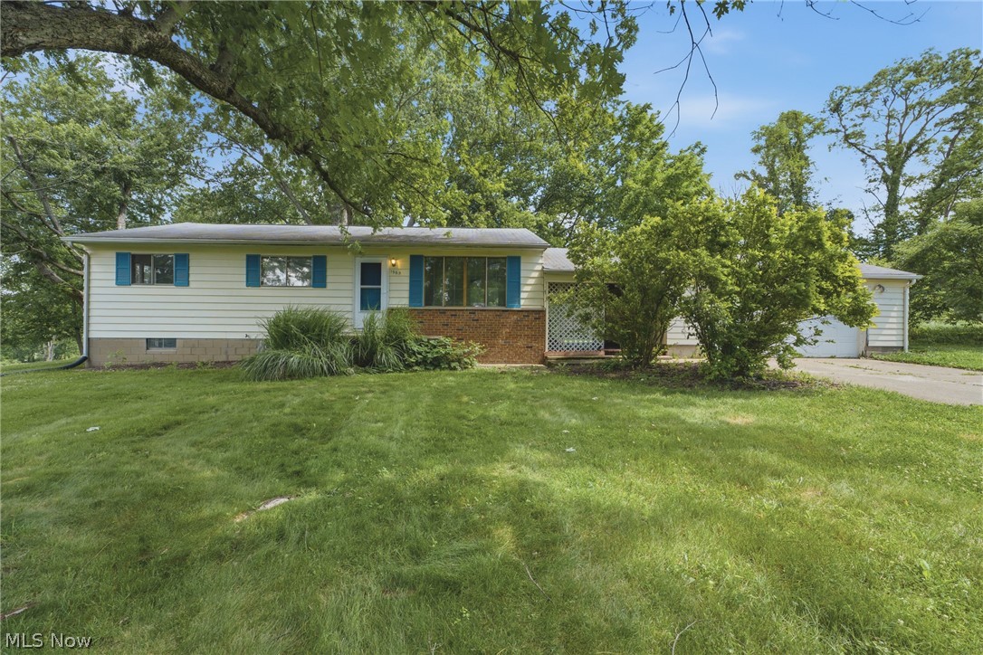 Tucked away on 1.63 wooded acres in Green Local Schools, this 3-bedroom ranch offers a rare combination of privacy and convenience. Warm wood flooring flows throughout the home, while recent updates including a new furnace and air conditioning provide peace of mind. The setting feels like your own retreat, with mature trees surrounding the property and a small fenced area in the backyard perfect for pets, play, or gardening. Just minutes from shopping, dining, parks, and the airport, you’ll enjoy the best of both worlds—seclusion when you want it and easy access when you need it. Whether you’re looking for a place to make your own or searching for land and location that are hard to find, this property is full of opportunity.