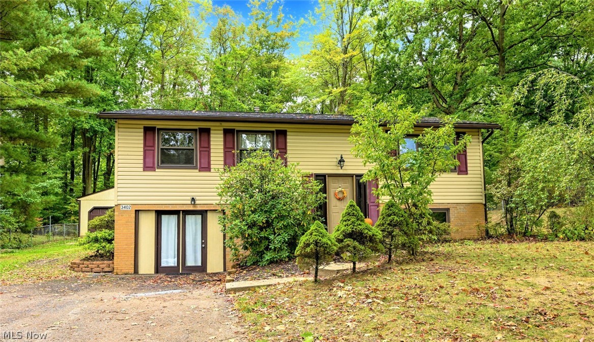 *WELCOME HOME To This Remarkable Bi-Level In Norton On Lullaby Lane In The Desirable Melody Village Neighborhood! *2,080 Sq. Ft. Includes 4 Bdrms, 2 Bathrooms - Upper & Lower Finished Walkout Level! *Oversized 2 Car Detached Garage W/Liftmaster Keypad, Shed, 3/4 FENCED IN YARD On .33 Acres! *Relax And ENTERTAIN On The NEW 2021 Large DECK Which Spans Almost The Entire Back Of Home! *Major Updates Include: LUXURY Plank Flooring 2022, New FURNACE and CENTRAL AIR 2016, Main Bathroom Updated Tub/Shower/Flooring & MORE *Walk In To A Foyer W/10 Ft Ceiling *Upstairs Is The Main Living Rm W/Hardwood Floors & Walls W/White Beadboard Accents  *The Dining Rm Features A New Modern Remote Controlled Hunter Ceiling Fan & Door To The New Back Deck *Kitchen W/Appliances, Above Sink Track Lighting & Cabinets W/Lazy Susan *3 Bdrms Main Floor Include 1 W/A Remote Controlled Ceiling Fan & Another W/Dimmer Light ~ Cozy Carpet *Full Main Floor Bathrm Boasts LUXURY Plank Flooring, Built in Linen Closet + Vani
