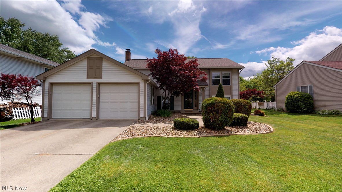 Welcome to this fully remodeled home in the Kelsey Creek Commons.  You won’t be disappointed with the updates! In addition to the wonderful design elements that you’ll read below, this home has a brand new roof, AC & furnace in 2018. This modern 4 bed/2 full bath home is truly move in ready! This home features a large custom island in the kitchen, can-lighting in the vaulted kitchen and living room, high-durability dark laminate hardwood flooring in living & dining area, as well as the main staircase, modern light gray tile in the downstairs foyer and laundry room, brand new carpet in EVERY bedroom and the HUGE downstairs living room with a fire place, stunning elevated outdoor patio for entertaining, large finished laundry room with utility sink and extra-large storage closet, and a convenient attached 2 car garage. This home is walking distance to WaterWorks Park & located near the Hike-n-Bike Trail system, minutes away from everything Cuyahoga Falls and just a few minutes from Route