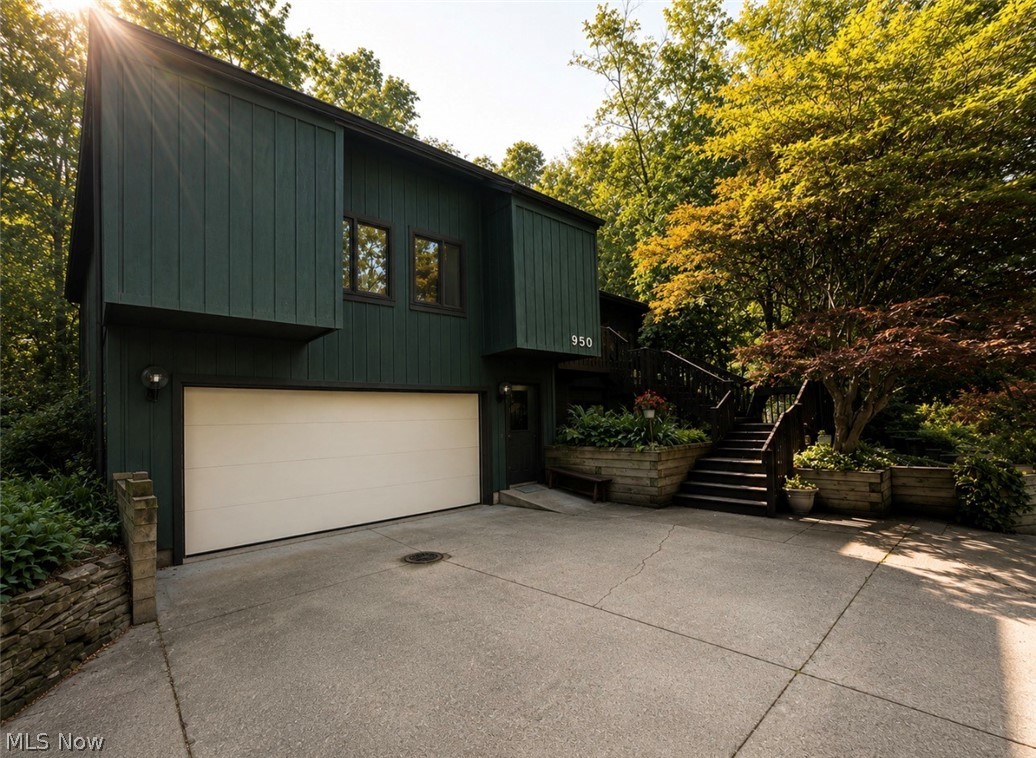 Perfectly situated on a beautiful piece of property surrounded by nature, offering a peaceful and private setting with so much to appreciate inside and out. Enter through the front door into a comfortable and welcoming entryway. To your right, you’ll find a spacious family room that flows into the formal dining room; large windows fill the space with beautiful natural light. Sliding glass doors off the dining room lead to the back deck, your own private escape overlooking a nature lover’s paradise. The kitchen offers an oversized pantry along with a separate eat-in dining area. From there, step down into the spacious lower family room, featuring a stunning full-wall stone wood-burning fireplace that creates an incredible focal point. Custom built-in shelving throughout the home adds both character and functionality. The first floor offers two generously sized bedrooms with large walk-in closets, a full bathroom, additional hallway built-ins, and abundant storage under the steps. Upstairs, the private primary suite feels like its own retreat. Beautiful skylights bring in natural light, while gorgeous double doors open to your own private balcony overlooking the peaceful natural surroundings. The bathroom features double sinks, a walk-in shower, and a full-room closet. Accessibility was thoughtfully incorporated throughout the home, including 36-inch-wide doors and numerous handicap-accessible features. The walkout lower level offers even more living space with a full recreation/living room, an additional bedroom, a completely handicap-accessible full bathroom with a walk-in shower. Beautiful Nature Stone flooring extends throughout the entire basement and lower-level family room, providing a durable and attractive finish. Major mechanical updates include a furnace and central air conditioning installed in 2024. A home that needs to be experienced in person to fully appreciate everything it has to offer.